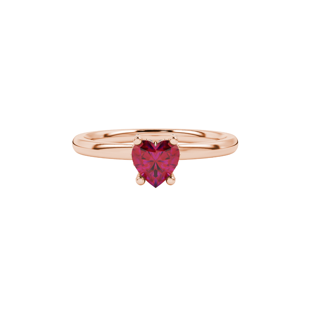 close-up of a heart-shaped raspberry red gemstone with a diamond pavé basket gallery in rose gold.
