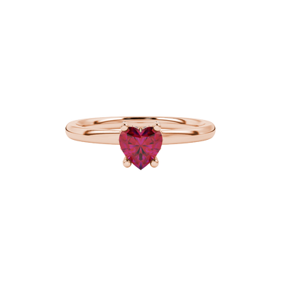 close-up of a heart-shaped raspberry red gemstone with a diamond pavé basket gallery in rose gold.