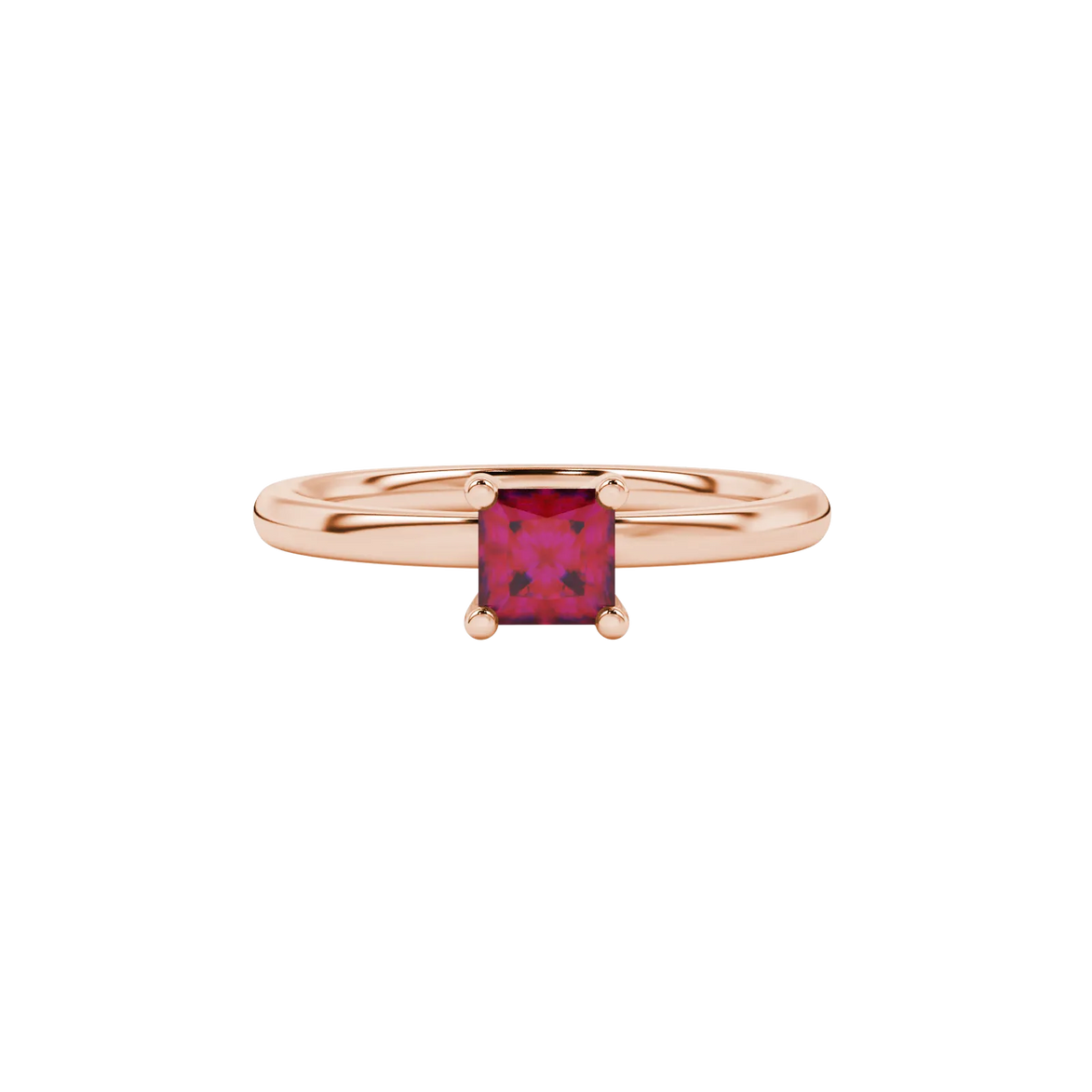 Close-up, princess raspberry red gemstone ring, rose gold four-prong setting.