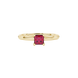 Close-up, princess raspberry red gemstone, yellow gold four-prong ring.