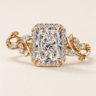 Radiant cut lab grown diamond engagement ring with rectangular pavé halo, floral vine cathedral shoulders, marquise diamond accents and polished yellow gold.