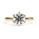 Gold ring with a large diamond on a white background
