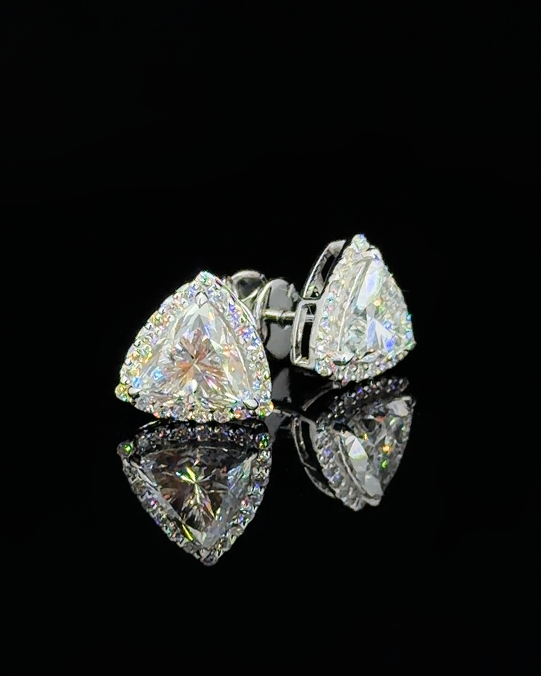 White gold curved trillion halo stud earrings with lab grown diamonds on black