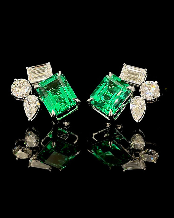 White gold green emerald birthstone earrings with mixed-cut lab grown diamonds on black
