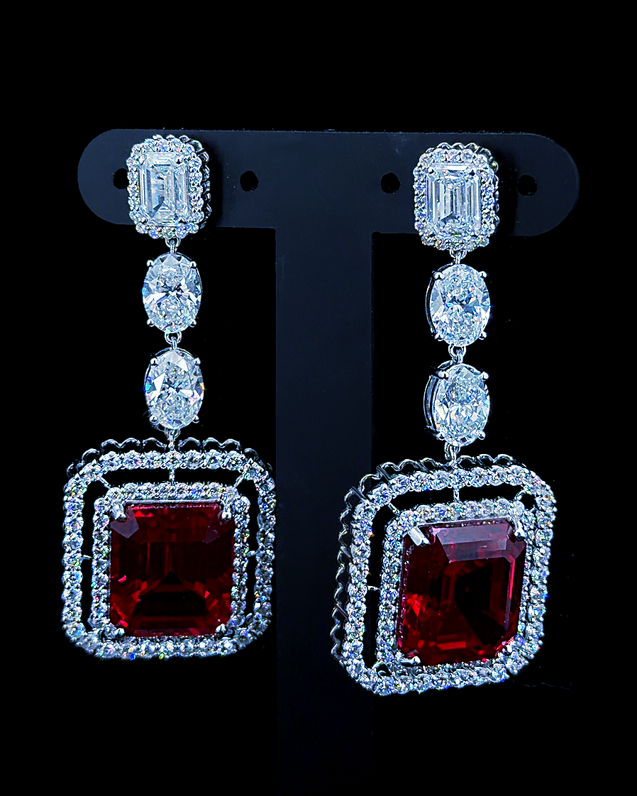 White gold red gemstone drop earrings with oval, emerald and round lab grown diamonds on black