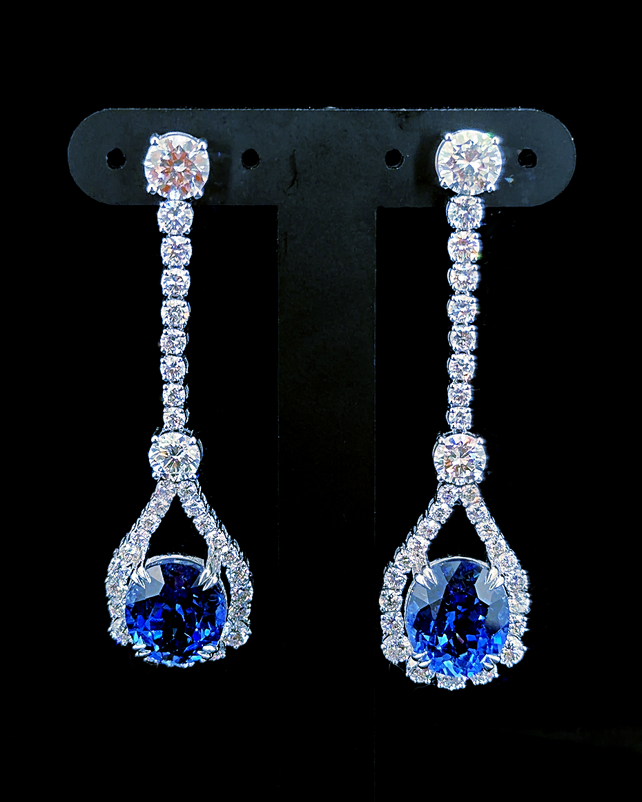 White gold oval blue birthstone drop earrings with round lab grown diamonds on black