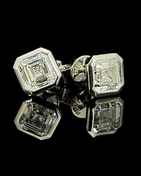 White gold princess solitaire stud earrings with 0.90ct total lab grown diamonds on black
