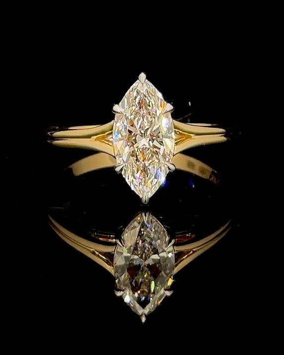 Main: Yellow gold 1.45ct marquise solitaire ring with lab grown diamond centre on black
Detail: Close-up of 1.45ct marquise lab grown diamond held by six yellow gold prongs
Side: Yellow gold marquise solitaire ring with open split-shank shoulders and raised setting