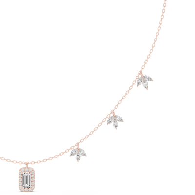 emerald and marquise diamond halo pendant in rose gold