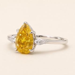 Pear Intense Yellow Lab Grown Diamond Three-Stone Engagement Ring with Trillion Side Diamonds in White Gold