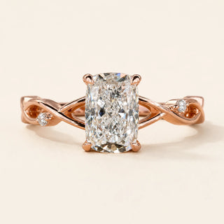Elongated cushion Lab Grown Diamond cathedral engagement ring in rose gold with a twisted vine shank and two round accents.