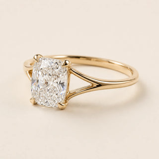 Elongated cushion Lab Grown Diamond solitaire engagement ring in yellow gold with a split cathedral shank and four-prong open basket.