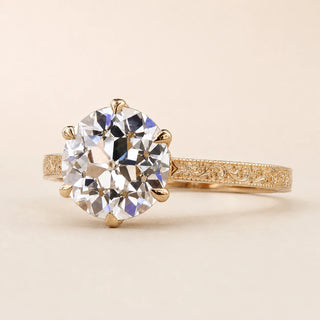 Old European cut Lab Grown Diamond vintage engagement ring in yellow gold with a six-prong lotus basket and engraved milgrain band.