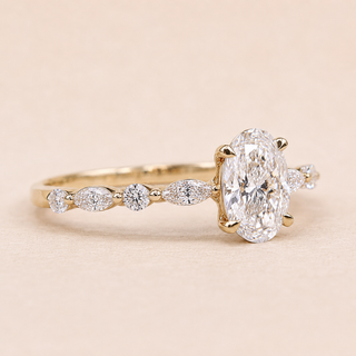 Oval Lab Grown Diamond Solitaire Engagement Ring with Marquise & Round Accent Shoulders in Yellow Gold
