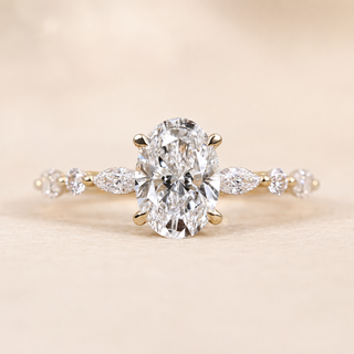 Oval Lab Grown Diamond Solitaire Engagement Ring with Marquise & Round Accent Shoulders in Yellow Gold