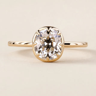 Cushion Old Mine Cut Lab Grown Diamond bezel engagement ring in yellow gold with an open basket gallery and comfort-fit shank.