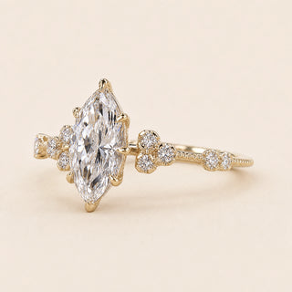 Dutch Marquise cut lab grown diamond halo engagement ring in 18K yellow gold with six-prong setting and plain comfort-fit band.