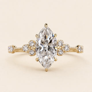Dutch Marquise cut lab grown diamond halo engagement ring in 18K yellow gold with six-prong setting and plain comfort-fit band.