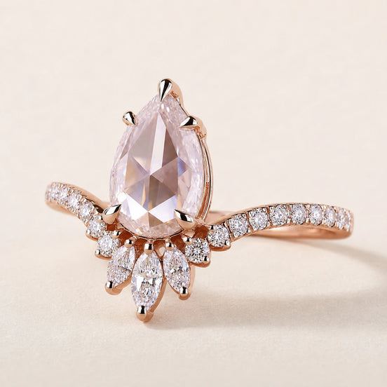 Pear rose cut Lab Grown Diamond nature inspired engagement ring in rose gold with pavé split shoulders and a floral marquise cluster.