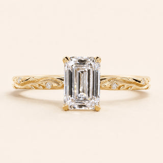 Emerald cut Lab Grown Diamond vintage engagement ring in yellow gold with a double-claw cathedral basket and engraved shank.
