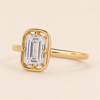 Emerald cut Lab Grown Diamond compass engagement ring in yellow gold with a compass four-prong bezel-frame setting.