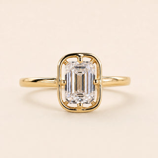 Emerald cut Lab Grown Diamond compass engagement ring in yellow gold with a compass four-prong bezel-frame setting.