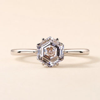 Hexagon step cut Lab Grown Diamond solitaire engagement ring in white gold with a six-prong cathedral basket.