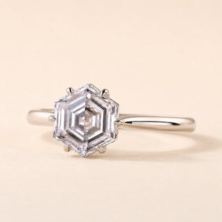 Hexagon step cut Lab Grown Diamond solitaire engagement ring in white gold with a six-prong cathedral basket.