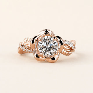 Round Lab Grown Diamond floral engagement ring in rose gold with a six-petal flower basket and leaf pavé shoulders.