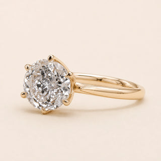 Portuguese cut round Lab Grown Diamond engagement ring in white gold with a six-prong lotus basket and pinched comfort-fit shank.