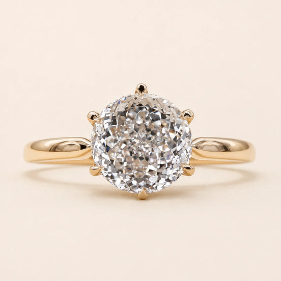 Portuguese cut round Lab Grown Diamond engagement ring in white gold with a six-prong lotus basket and pinched comfort-fit shank.
