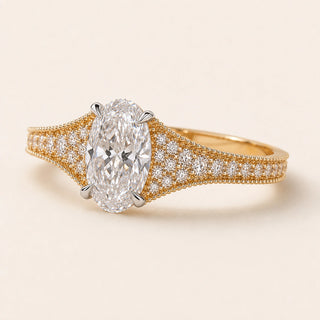 Oval Lab Grown Diamond split pavé engagement ring in yellow gold with a four-prong cathedral basket and hidden diamond gallery.
