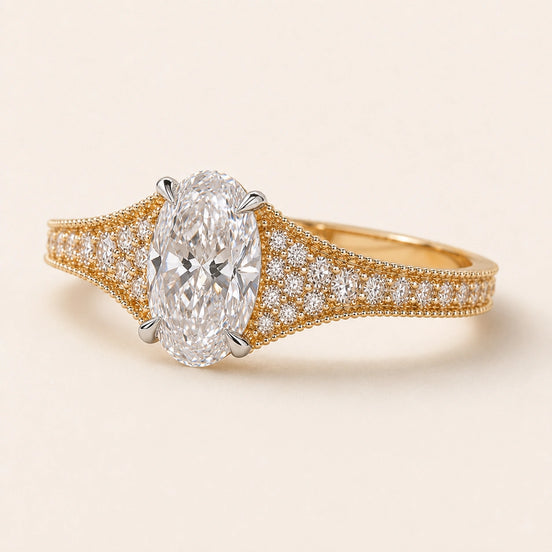 Oval Lab Grown Diamond split pavé engagement ring in yellow gold with a four-prong cathedral basket and hidden diamond gallery.