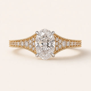 Oval Lab Grown Diamond split pavé engagement ring in yellow gold with a four-prong cathedral basket and hidden diamond gallery.