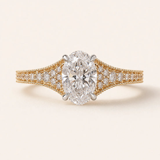 Oval Lab Grown Diamond split pavé engagement ring in yellow gold with a four-prong cathedral basket and hidden diamond gallery.