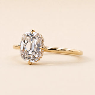 Cushion Old Mine Cut Lab Grown Diamond hidden halo engagement ring in yellow gold with a compass four-prong setting.
