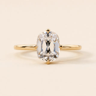 Cushion Old Mine Cut Lab Grown Diamond hidden halo engagement ring in yellow gold with a compass four-prong setting.