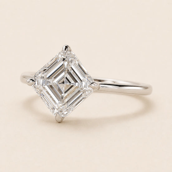 Asscher cut Lab Grown Diamond compass engagement ring in white gold with a four-prong cathedral basket and open gallery.
