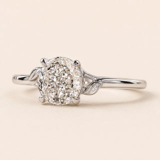 Portuguese cut round Lab Grown Diamond engagement ring in white gold with twisted cathedral shoulders and a four-prong open basket.