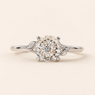 Portuguese cut round Lab Grown Diamond engagement ring in white gold with twisted cathedral shoulders and a four-prong open basket.