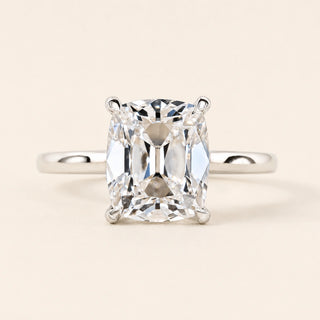 Cushion Old Mine Cut Lab Grown Diamond solitaire engagement ring in white gold with double-claw prongs and a cathedral basket.