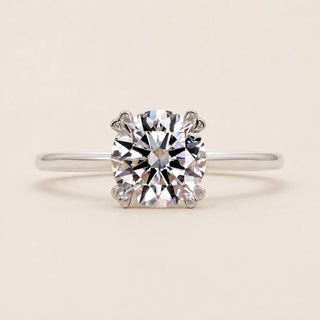 Round Lab Grown Diamond solitaire engagement ring in white gold with a six-prong cathedral basket diamond.