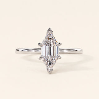 Long hexagon step cut Lab Grown Diamond solitaire engagement ring in white gold with a four-prong cathedral open basket.