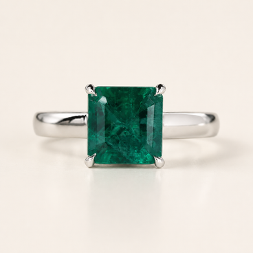 Green birthstone cathedral basket gemstone engagement ring in white gold