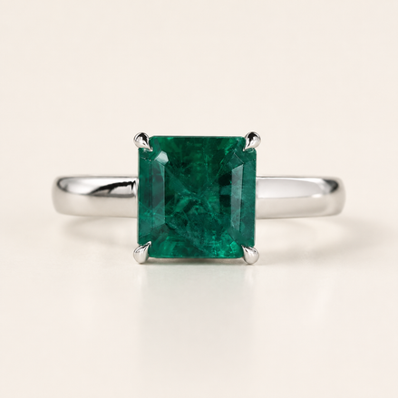 Green birthstone cathedral basket gemstone engagement ring in white gold