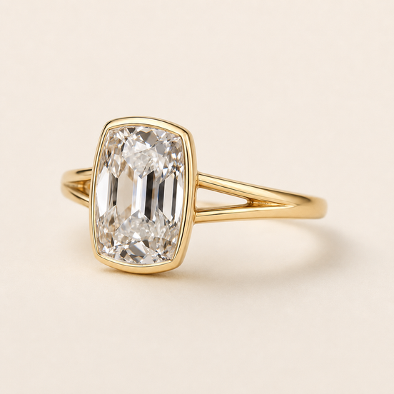 Cushion cut lab grown diamond bezel engagement ring in yellow gold with open split-shank shoulders