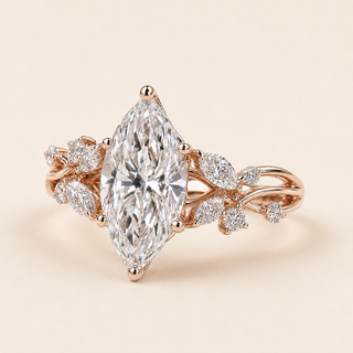 Marquise cut lab grown diamond cluster engagement ring in rose gold with mixed-shape leaf and open vine shoulders