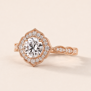 Round cut lab grown diamond halo engagement ring in rose gold with geometric pavé halo and twisted shoulders