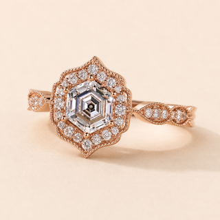 Hexagon cut lab grown diamond halo engagement ring in rose gold with geometric pavé halo and twisted shoulders