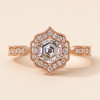 Hexagon cut lab grown diamond halo engagement ring in rose gold with geometric pavé halo and twisted shoulders